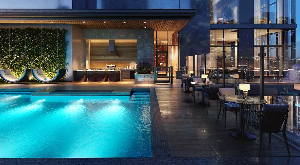 Pool terrace at night at Hanover Brazos Street apartments in Austin TX
