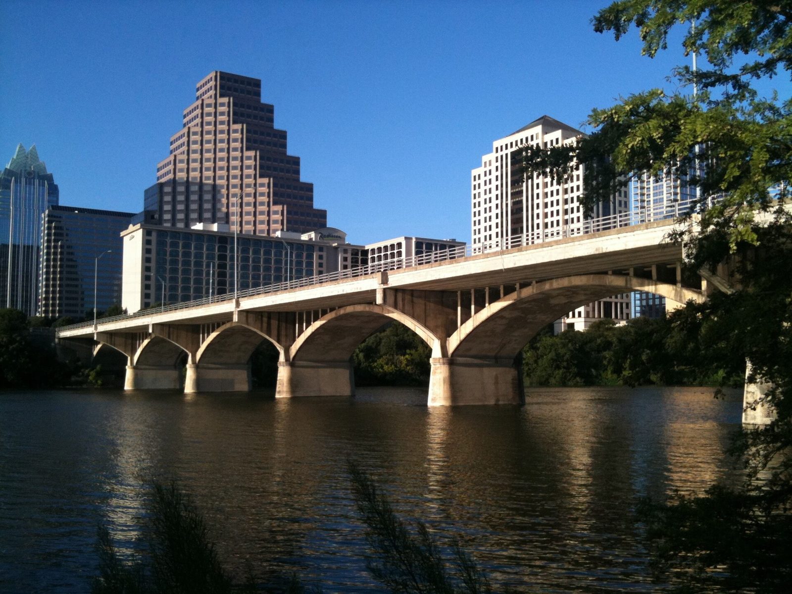 The Congress Avenue Bridge over Lady Bird Lake with the downtown Austin skyline